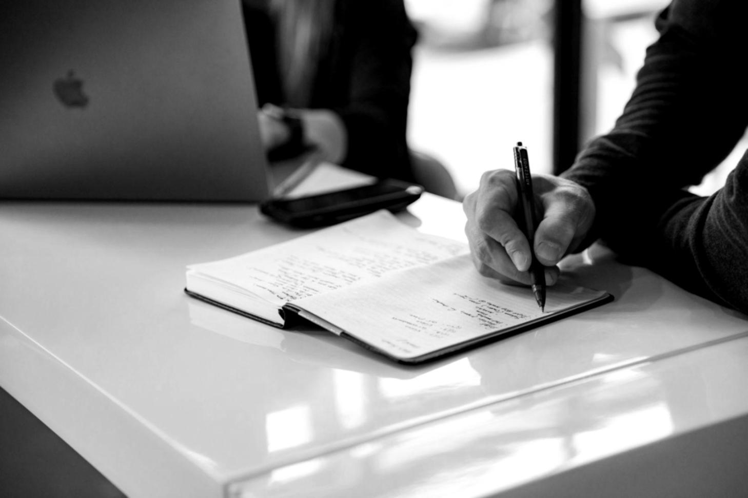 Professional financial planning workspace with documents and analysis tools